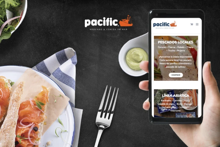 person viewing the pacific home page while eating